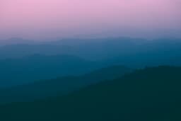 Layers of misty hills at dusk, seen from the Doi Pui viewpoint above Chiang Mai